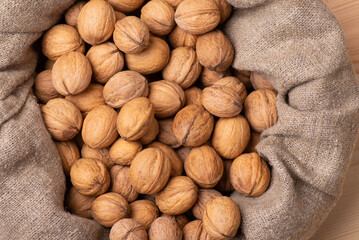 Close-up shot of walnut linen bag. Harvest of walnuts