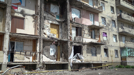 Fototapeta na wymiar A destroyed residential building in Ukraine after the attack of the Russian army