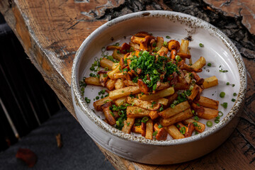 Fried potatoes with chanterelle mushrooms