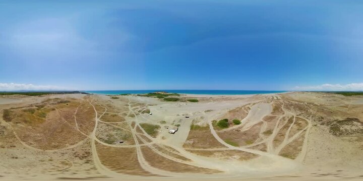 Beach and Paoay sand dune. Sand dunes near to the sea. Monoscopic image. Paoay Sand Dunes, Ilocos Norte, Philippines.