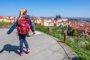 Fototapeta na wymiar Young blonde girl enjoying Prague