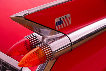 car tail lights and fin and USA flag
