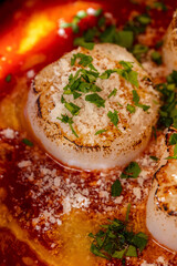 Fried sea scallop with tomato sauce
