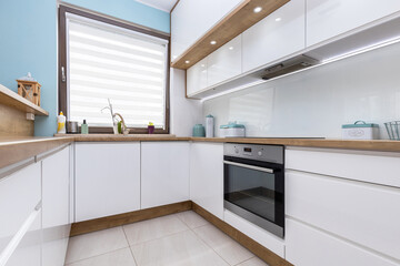 Fototapeta Modern white kitchen interior with wooden worktops obraz