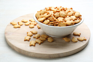 Delicious goldfish crackers in bowl on table