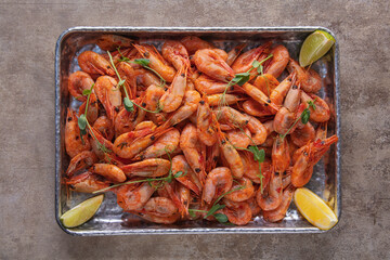 Boiled shrimps in a sauce with lemon and pea sprouts
