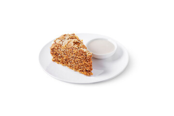 A slice of waffle cake with almond slices and sauce