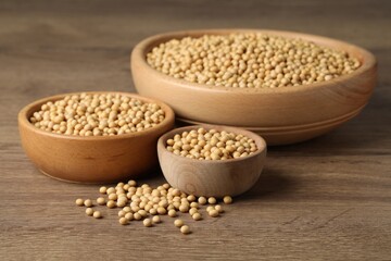 Natural organic soy beans on wooden table