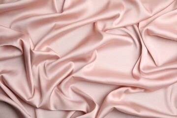 Fototapeta premium Texture of delicate pink silk as background, top view