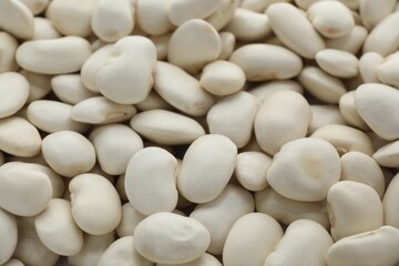 Pile of uncooked white beans as background, closeup