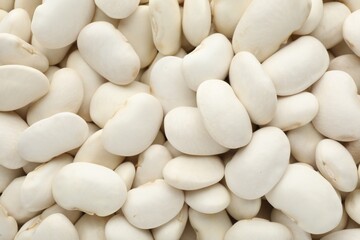 Pile of uncooked white beans as background, closeup