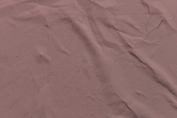 Colored paper with a wrinkled dry texture. Rough grunge wrinkle pattern. Vintage paper texture.