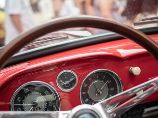 Fototapeta Dashboard and steering wheel of old-timer car obraz