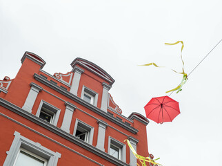 Fototapeta colorful umbrellas in the city against the sky obraz