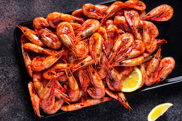 Boiled shrimps in sauce with lemon