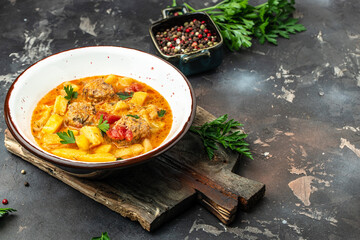 stew vegetables with meatballs on a dark background, Delicious balanced food concept, place for text, top view