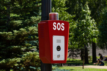 Fototapeta na wymiar SOS, police, emergency button in the public park.