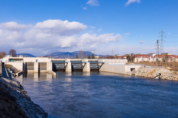 View of the hydro-electric power plant Puntigam in Graz, Austria at the river Mur on a stormy...