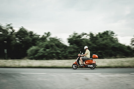 man drives a scooter