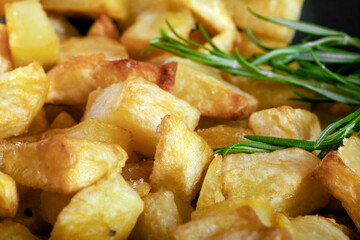 Macro close-up of homemade baked potatoes with rosemary.