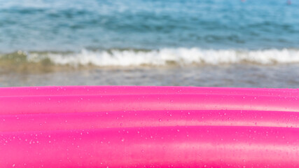 Inflatable mattress at the beach with sea in background. Copy space, add text or object