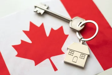 Crédence de cuisine en verre imprimé Canada House with the flag of Canada. Immigration to Canada. Buying real estate. Houses for rent in Ottawa. Property price. Acquisition of real estate in another state.
