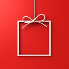 Hanging gift box frame border isolated on red background with shadow minimal conceptual 3D rendering