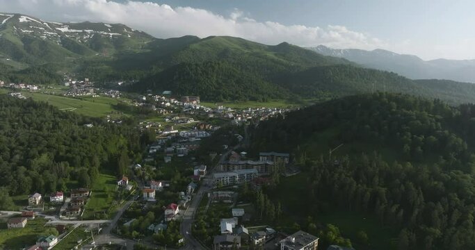 Greenery Forest Mountains Reveal Bakuriani Ski Resort Town In Borjomi District of Georgia. Aerial Tilt-down