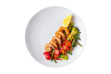 Salad with carrots, shrimps, asparagus beans, broccoli and tomatoes and lemon