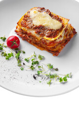 Lasagna with cheese, meat, ketchup, puff pastry, tomatoes and mung bean salad