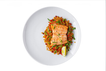 Grilled salmon steak with grits, lemon, thyme, parsley and pepper