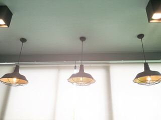 Traditional ceiling lamps hanging from the ceilling in vintage style decoration of the house in...