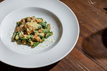 Parmesan with fish and green pods
