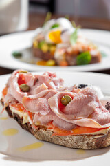 Sandwich with meat, chickpeas, tomatoes and sauce