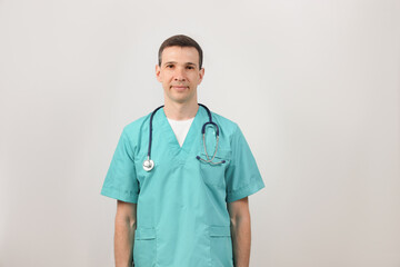 Medical services. Portrait of a young doctor with a stethoscope. Copy space.