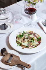 Cheese with truffle and arugula