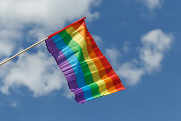 LGBT flag on blue sky background