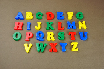 Alphabet on color background. School and education concept. Empty space for text and design
