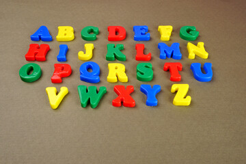 Alphabet on color background. School and education concept. Empty space for text and design