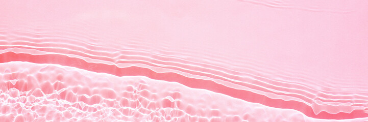 Fototapeta premium Background, texture of transparent pink water with seething ripples , waves