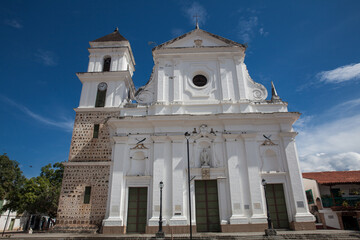Fototapeta na wymiar The historical Cathedral Basilica of the Immaculate Conception built between 1797 and 1837 in the beautiful town of Santa Fe de Antioquia in Colombia