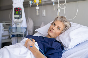 Senior woman resting on hospital bed