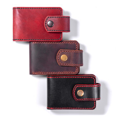 Set of three luxury craft business card holder cases made of leather.