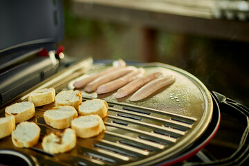 Fototapeta Prepare breakfast roasting bruschetta on the barbecue gas grill obraz