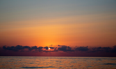Obraz na płótnie Canvas Fantastic Sunset on the Ocean. Nspirational Calm Sea with Sunset sky. Meditation Ocean and Sky Background.