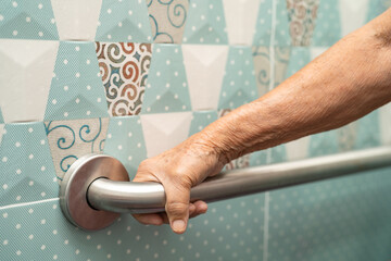 Asian senior or elderly old lady woman patient use toilet bathroom handle security in nursing hospital ward, healthy strong medical concept.