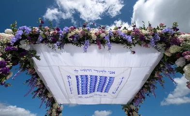Fotobehang Chuppa wedding canopy under which Jewish couple get married. Canopy is inscribed with words from biblical book Song of Songs and reads: I am to my beloved and my beloved is to me. © Lois GoBe