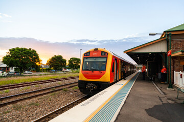 Blurred workers waiting at train station to commute home after work