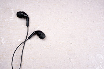 Top view of Mobile phone with headphones isolated on colorful background, Listen to music. Space for text