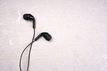 Top view of Mobile phone with headphones isolated on colorful background, Listen to music. Space for text